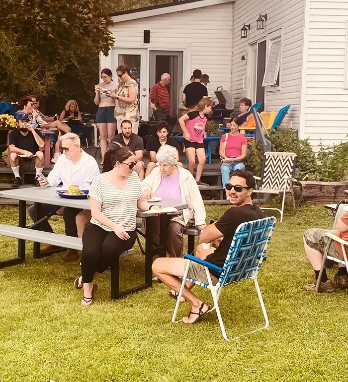 Church members sitting outdoors during fellowship at First Baptist Church Port Hope